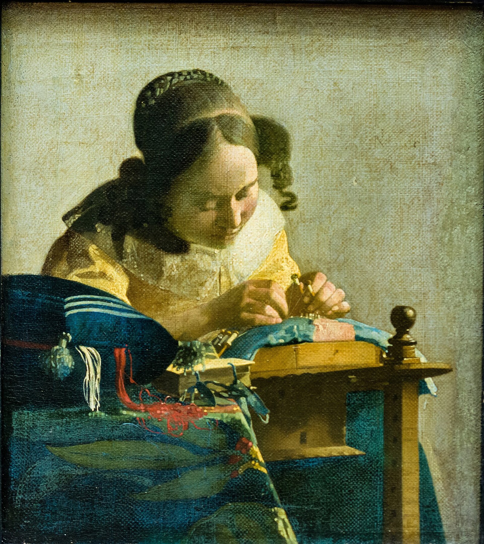 Hand-painted oil reproduction of The Lacemaker, the 1670 Johannes Vermeer intimate study of a girl bent over her work