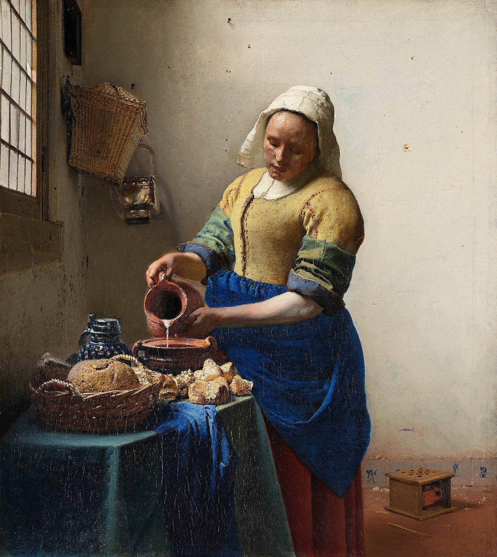 Hand-painted oil reproduction of The Milkmaid, Johannes Vermeer domestic scene of a maid pouring milk in luminous Delft light