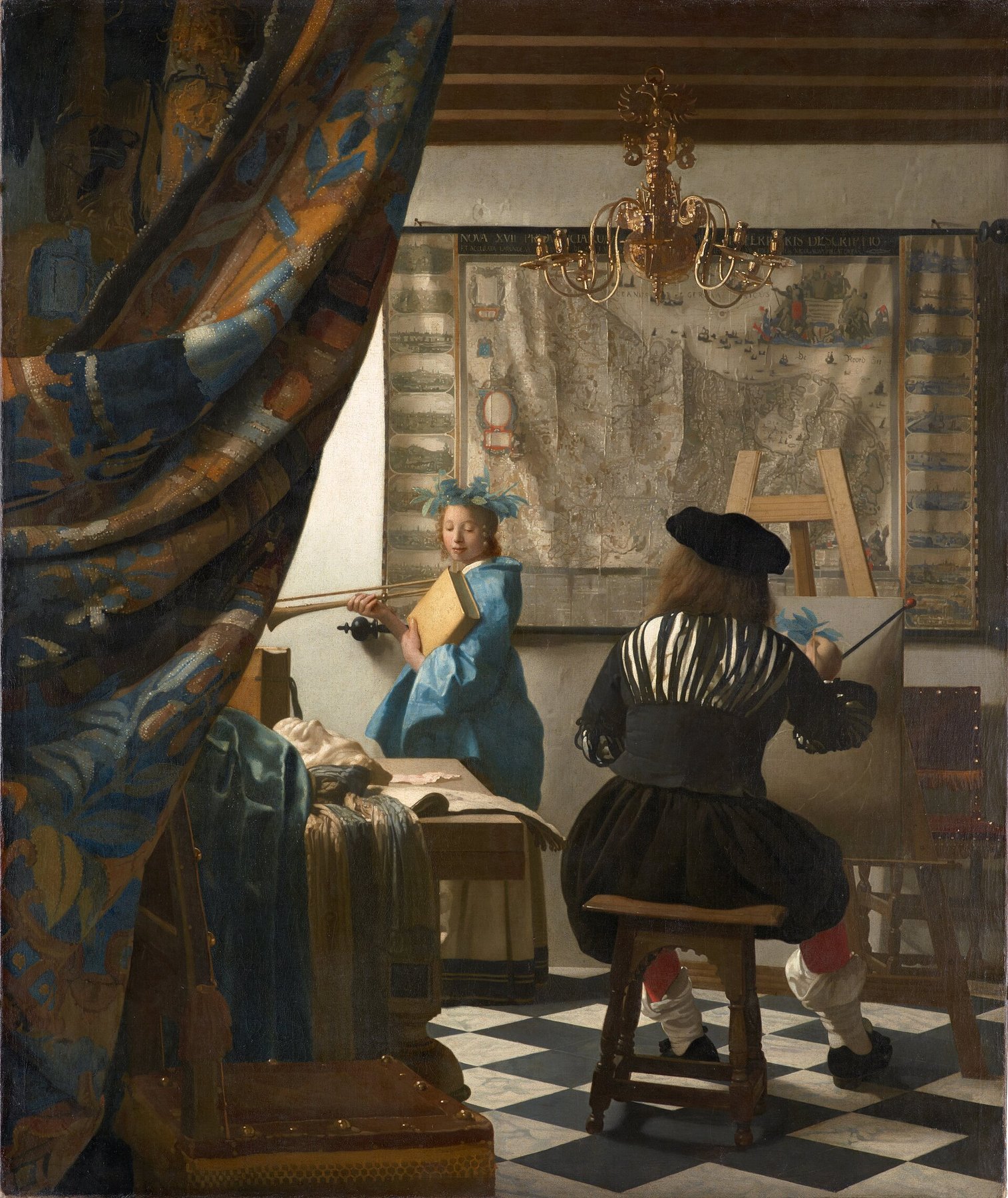 Hand-painted oil reproduction of The Art of Painting, Vermeer painter at his easel with a model in blue holding trumpet and book beneath a chandelier